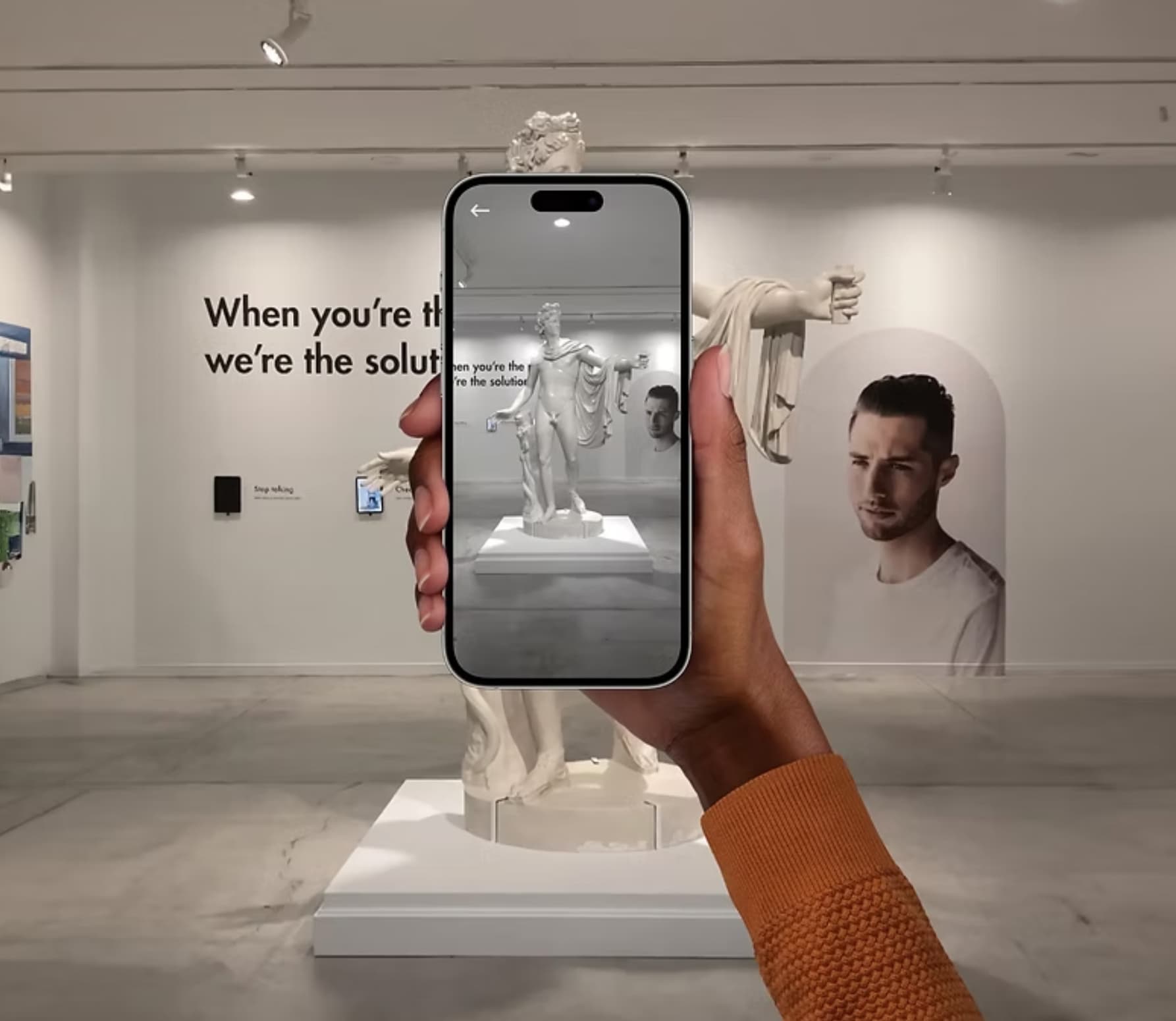 Graphic of a typography specimen showing the alphabet and numerals on top of a dark gray background.